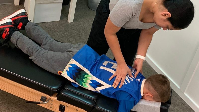 A child being adjusted at Firefly Chiropractic in Wauwatosa